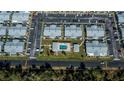 Community view showcasing homes, pool, and parking at 3300 Loveland Blvd # 3103, Punta Gorda, FL 33980