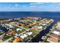 Expansive aerial view of waterfront home in a charming community at 48 Hibiscus Dr, Punta Gorda, FL 33950