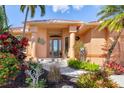 Welcoming entryway with decorative glass door and nicely landscaped walkway at 5301 Almar Dr, Punta Gorda, FL 33950