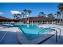 Community pool with surrounding patio and palm trees at 368 Catamaran Ct, North Port, FL 34287