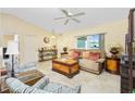 Living room with couch, chairs, and coffee table at 3863 S Chamberlain Blvd, North Port, FL 34286