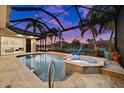 Inviting pool and spa with a covered patio, perfect for relaxation at 1422 Kittiwake Dr, Punta Gorda, FL 33950