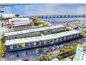 Aerial view showing condo building, parking, and waterfront location at 150 Harborside Ave # 313, Punta Gorda, FL 33950