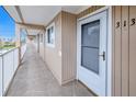 Condo hallway with light beige walls and tiled floors at 150 Harborside Ave # 313, Punta Gorda, FL 33950
