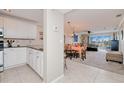 Open kitchen with granite counters, white cabinets, and stainless steel appliances at 150 Harborside Ave # 313, Punta Gorda, FL 33950