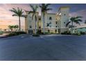 Three-story building with parking and tropical landscaping at 3340 Wood Thrush Dr # 323, Punta Gorda, FL 33950