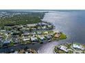 Aerial view of the waterfront neighborhood, surrounded by water and lush greenery at 4431 Gardner Dr, Port Charlotte, FL 33952