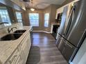 Bright kitchen with stainless steel appliances and granite countertops at 4435 Inverness St, North Port, FL 34288