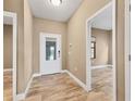 Bright and airy foyer with tile floors and neutral wall colors at 11137 Mcdermott Ct, Englewood, FL 34223