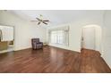 Bright living room featuring hardwood floors and a ceiling fan at 157 Troutdale St, Port Charlotte, FL 33954