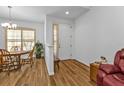 Bright dining area with wooden table and chairs, adjacent to the entryway at 1766 Dunvegan Dr, Punta Gorda, FL 33980