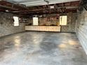 Spacious two-car garage with built-in cabinets and shelving at 627 Palm Ave, Punta Gorda, FL 33950