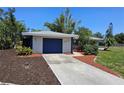 A well maintained home with a clean driveway and a one car garage door at 1108 Ample Ave, Port Charlotte, FL 33948