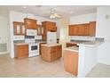 Kitchen boasts ample wood cabinets and an island at 12415 Catalina Dr, Punta Gorda, FL 33955
