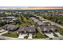 Aerial view showcasing community pool and surrounding villas at 26155 Explorer Rd # 1C, Punta Gorda, FL 33983