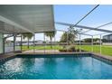 Inviting screened pool with canal views at 115 Leland Se St, Port Charlotte, FL 33952