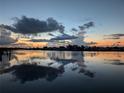 Stunning sunset view over calm canal waters at 193 N Waterway Nw Dr, Port Charlotte, FL 33952