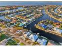 Stunning aerial view of a waterfront community with luxurious homes and boat docks at 2750 W Marion Ave, Punta Gorda, FL 33950