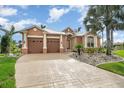 Two-story house with a two-car garage and nicely landscaped yard at 3324 Antigua Dr, Punta Gorda, FL 33950