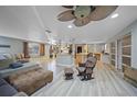 Open concept living room and kitchen with hardwood floors at 3355 Elkcam Blvd, Port Charlotte, FL 33952