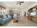 Spacious living room with tiled floors and leather sofas at 87 Vivante Blvd # 8736, Punta Gorda, FL 33950