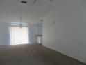 Bright and airy living room with carpet and sliding glass door at 1073 Marcus St, Port Charlotte, FL 33952
