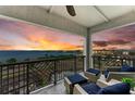 Relax on this inviting balcony with comfortable seating and enjoy breathtaking water views at sunset at 1425 Park Beach Cir # 149, Punta Gorda, FL 33950