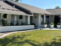 Well-maintained single-story home with manicured lawn and attractive landscaping at 3202 Meadow Run Dr, Venice, FL 34293