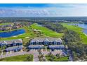 Aerial view of community with golf course and lake at 14070 Heritage Landing Blvd # 423, Punta Gorda, FL 33955
