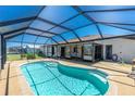 Inviting covered pool area, perfect for relaxation and entertainment. Includes a screened enclosure at 164 Chelsea Nw Ct, Port Charlotte, FL 33952