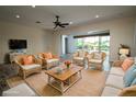 Spacious living room with neutral walls and wicker furniture at 8242 Lakeside Dr, Englewood, FL 34224