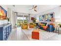 Bright living room with stylish furniture, decor, and sliding glass doors to the outside at 9368 Sunbeam Cir, Punta Gorda, FL 33950