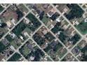 Overhead view of property featuring lush landscaping and a peaceful neighborhood setting at 5435 Montego Ln, Port Charlotte, FL 33981
