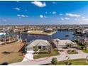 Charming single-story waterfront home in a desirable neighborhood, surrounded by lush landscaping and a private dock at 3932 Madrid Ct, Punta Gorda, FL 33950