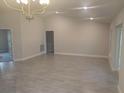 Open living room with tile floors and recessed lighting, perfect for entertaining guests at 4063 Conestoga St, Port Charlotte, FL 33948