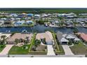 Waterfront home with a tile roof, palm trees, located on a canal community with boat docks and beautiful landscaping at 5430 Almar Dr, Punta Gorda, FL 33950