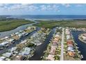 Waterfront canal home with a screened pool in a neighborhood with access to ocean and private boat docks at 5430 Almar Dr, Punta Gorda, FL 33950