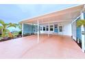 This covered carport boasts ample parking and a charming entrance to the home at 6642 Acacia Ct, North Port, FL 34287