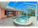 Backyard boasts a sparkling pool and spa, perfect for relaxation and entertaining at 126 Peckham Sw St, Port Charlotte, FL 33952