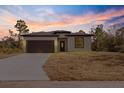 Beautiful new construction home features a attached garage and freshly laid lawn at 158 Chickering St, Port Charlotte, FL 33954