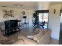 Bright living room showcases tile flooring, neutral decor, and an open layout at 3380 Maple Ter, Port Charlotte, FL 33952