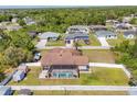Aerial of backyard showcasing pool, patio, and fenced yard at 23239 Stelling Ave, Punta Gorda, FL 33980
