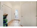 Bright entryway with tile flooring, closet, and a door featuring decorative glass at 20272 Lagente, Venice, FL 34293