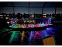 Backyard view with illuminated decorations at night at 349 Springview Nw Cir, Port Charlotte, FL 33948