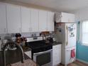 Functional kitchen with ample cabinet space and stainless steel appliances at 5233 Palena Blvd, North Port, FL 34287