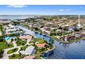 Aerial view of homes on canals, revealing boat docks, waterfront living and neighborhood layout at 1118 Treasure Cay Ct, Punta Gorda, FL 33950