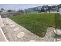 Well-manicured backyard and waterfront access creating a relaxing outdoor oasis with easy access to the water at 11723 1St E St, Treasure Island, FL 33706