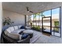 Relaxing screened-in patio with comfortable seating, a ceiling fan, and lovely outdoor views at 14184 Heritage Landing Blvd # 516, Punta Gorda, FL 33955