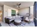 Relaxing screened-in patio with comfortable seating, ceiling fan, and natural light at 14184 Heritage Landing Blvd # 516, Punta Gorda, FL 33955