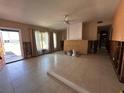 Open-concept living room undergoing renovations with tile flooring and natural light at 3120 Wisteria Pl, Punta Gorda, FL 33950